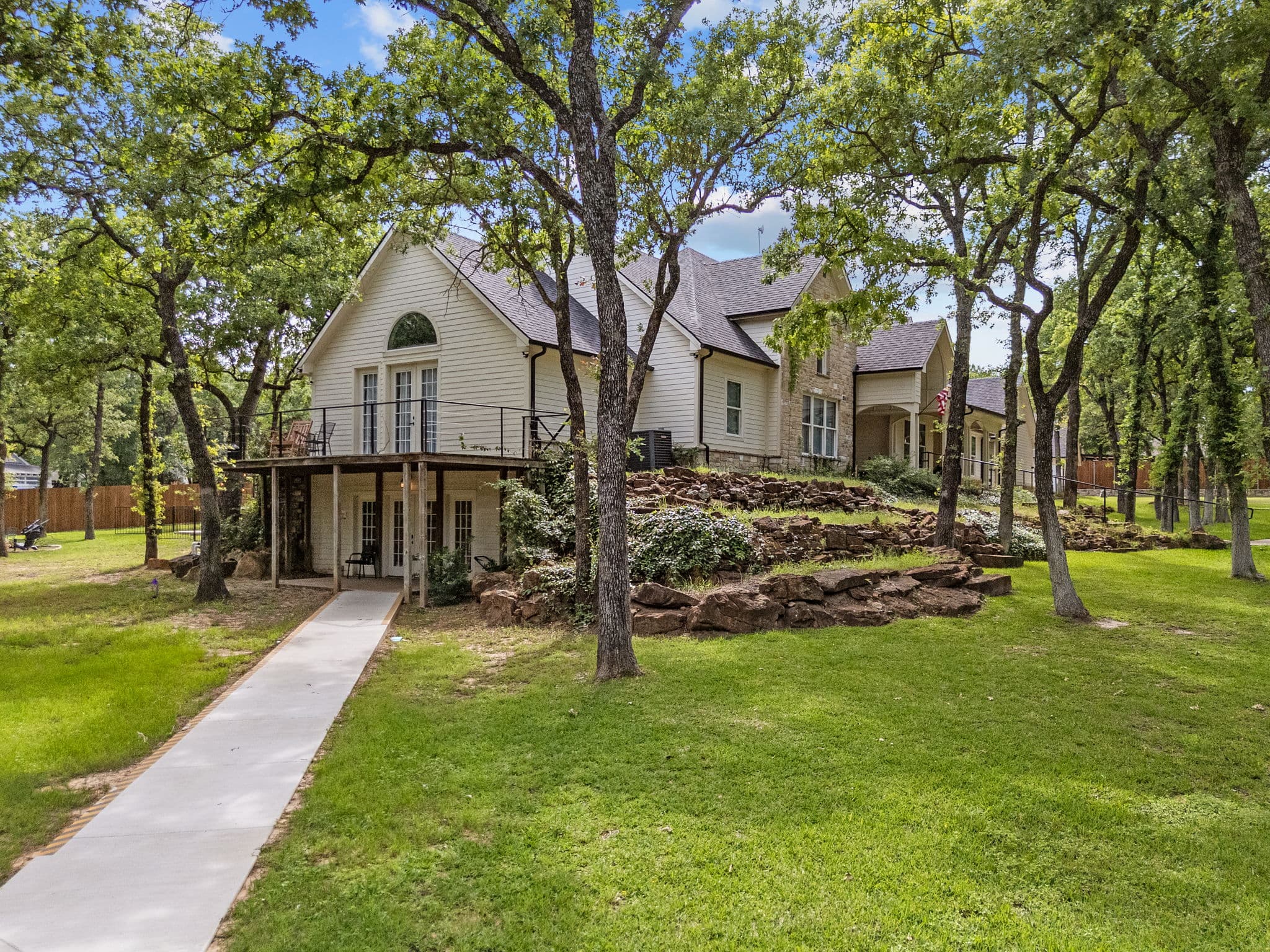 The side elevation of the main house and its terraced grounds at Fort Worth Wellness Center